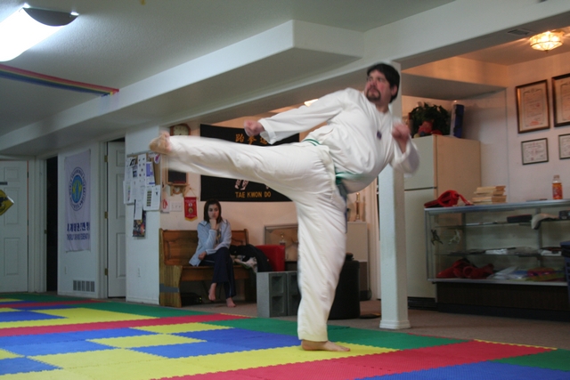 Mr. Jason Bailey demonstrates a side kick